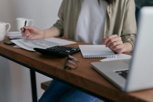 Woman preparing financial documents for grant applications