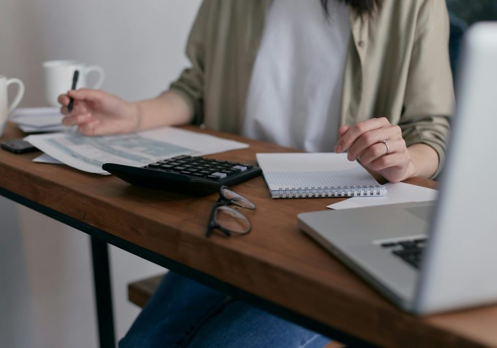 Woman preparing financial documents for grant applications